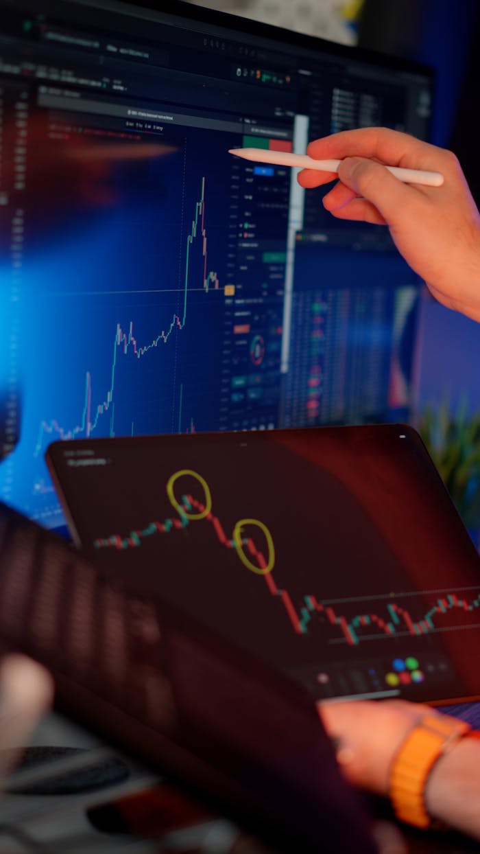 Mastering the First Impression: Your intriguing post title goes here A person analyzes cryptocurrency market trends on multiple screens with graphs.